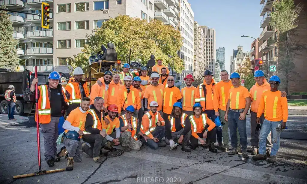 Group of 25 construction workers posing.